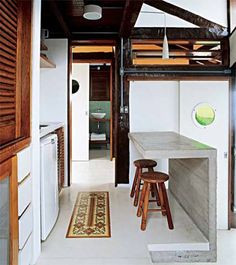 a kitchen with stools and a counter in it