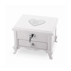 a small white box with a heart on the lid and handles, sitting next to a drawer