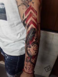 a man's arm with an american flag and clock tattoo on the left arm