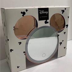 an opened box with mickey mouse's ears on it