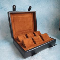 Handmade leather watch box for 6 watches with goat leather suede interior - dark blue exterior, tan interior.  ✓ The exterior of the watch case is made from Italian calfskin leather. Your watches won't get scratched while in the watch box since the interior of the watch box and the cushions are lined with the best goat leather suede. ✓ This handmade watch box is particularly made for watch collectors and watch aficionados to safeguard their exquisite watches when traveling or at home. ✓ Allows 2 Rectangular Watches With Original Box As Gift, Classic Formal Watch Accessories With Gift Box, Rectangular Business Watch Accessories, Business Brown Watch Accessories Box, Classic Cases As Gifts, Business Brown Box Watch Accessories, Rectangular Watch Accessories In Original Box For Gift, Rectangular Watch Accessories With Original Box For Gift, Rectangular Watch Accessories With Original Box For Gifting