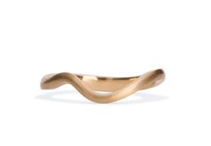 a gold wave ring on a white background