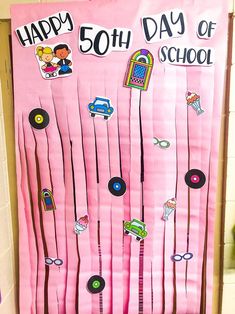 a pink door decorated with school supplies and the words happy 50th day of school