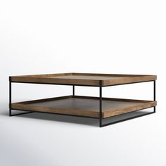 a wooden and metal coffee table with two shelves on each side, against a white background