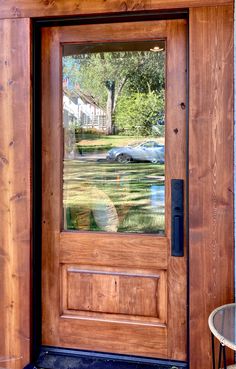 a wooden door with a glass pane