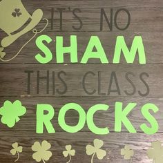 there is a sign that says it's no sham this class rocks with shamrocks