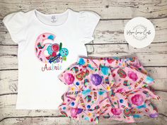 "This is a matching birthday outfit that is perfect to celebrate your little one's big day! The shirt had puffed sleeves and is embroidered. The skirt has 3 ruffles and even has shorts in it, making it a \"skort\"! This outfit is practical and high quality and will ensure that your little one gets a lot of compliments. You can choose if you only want the shirt, only want the skirt, or you want both.  I can also change up the embroidery colors to suit your needs! Be sure to include exactly what you want in the personalization tab. Get the matching hair accessories here: https://www.etsy.com/listing/1504698984/matching-hair-accessories?click_key=a2f7acde37ba5478f95ff79e60d795ce355e5044%3A1504698984&click_sum=ca762fa9&ref=shop_home_active_1&sts=1 Sizes: 12m, 18m, 2 years, 3 years, 4 years, 5 Fitted Short Sleeve Sets For Birthday, Cute Short Sleeve Sets For Birthday, Pink Short Sleeve Birthday Set, White Short Sleeve Birthday Set, White Short Sleeve Sets For Birthday, Playful Multicolor Birthday Sets, Cute Ruffled Sets For Birthday, Sweet White Sets For Birthday, Pink Cotton Sets For Birthday