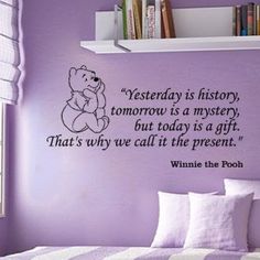 a purple bedroom with a teddy bear wall decal on the wall and a quote from winnie the pooh