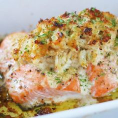 a piece of cooked salmon in a white dish