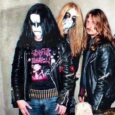 two men in black leather jackets standing next to each other with makeup on their faces