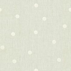 white polka dot fabric on a light green background for curtains and upholsters