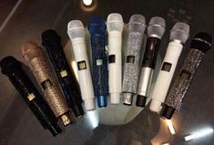 there are many different types of microphones on the table in front of each other