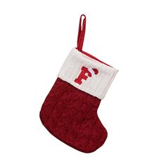 a red and white christmas stocking with the letter f on it