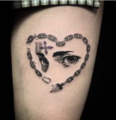 a woman's thigh with an eye and chain around her ankles, in the shape of a heart