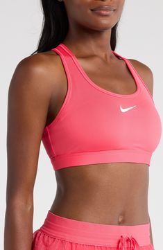 Work up a sweat on and off the pickleball court in this padded sports bra featuring wide straps and signature moisture-wicking tech. Racerback Dri-FIT moisture-wicking technology Lined 72% polyester, 28% spandex Machine wash, line dry Imported