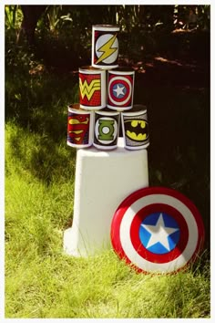 the captain's shield has been made out of cans and is sitting in the grass