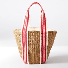 a red and white striped bag sitting on top of a table