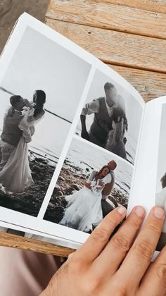 a person holding an open book with pictures on it and two people in the background