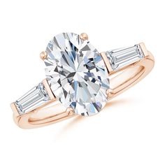 a rose gold engagement ring with two baguets on the shoulders and side stones