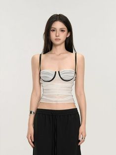 Embrace the mix of simplicity and allure with our Ruched Bustier Crop Top with Slim Straps. Its fitted silhouette and structured design offer a chic street-style edge. Crafted with a focus on texture, this crop top features delicate ruching that accentuates your shape, while the solid color design maintains a versatile and sophisticated look. The slim straps and bustier-style bodice are not just design elements; they provide support and enable a fit that's both flattering and comfortable. Whethe Fitted Cropped Crop Top With Boned Bodice, Fitted Crop Top With Boned Bodice, Stretch Cropped Summer Corset, Cropped Stretch Summer Corset, Summer Cropped Stretch Corset, Chic Fitted Bandeau Tank Top, Chic Cropped Corset With Built-in Bra, Spring Crop Top With Medium Bust Support, Elegant Fitted Bandeau Tank Top