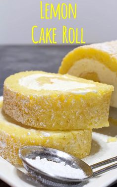 lemon cake roll on a plate with a spoon