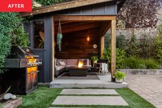 an outdoor living area with grass and fire pit