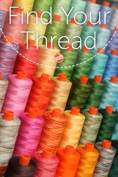 colorful spools of thread with the words find your thread