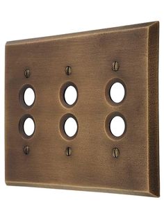 an antique brass finish wall plate with four holes in the middle and three on each side