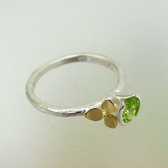 Hydrangea Stacking Ring Sterling Silver by PatrickIrlaJewelry, $194.00 Green Peridot Stackable Jewelry, Lime Green Peridot Rings In Fine Jewelry Style, Stackable Green Peridot Jewelry, Lime Green Peridot Rings Fine Jewelry, Elegant Green Peridot Stackable Rings, Unique Green Stackable Promise Rings, Unique Green Peridot Rings, Green Peridot Birthstone Ring, Green Peridot Birthstone Ring For May