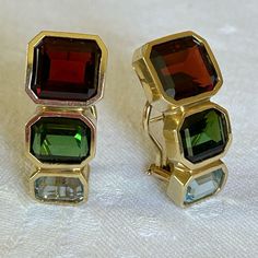 Stunning Pair Of 14k Yellow Gold Earrings Weighing Approximately 12.9 Grams With Emerald Cut Garnet, Peridot And Blue Topaz, French Clip Backs. Formal Multi-stone Fine Jewelry Earrings, Elegant Multicolor Gemstones For Formal Occasions, Multicolor Gemstone Accented Earrings For Formal Occasions, Formal Yellow Gold Multi-stone Earrings, Formal Multicolor Earrings, Artsy Earrings, White Flower Earring, French Clip, Gem Earrings