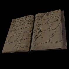 an open book with writing on it in the middle of a black background that appears to be handwritten