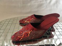 "Deeply red slippers with ornate stitching and accented with beads and sequins that can be worn for a dressy occasion as well as casual. Made By an Indian Company. There is no size marked butI tried them on and they were a little big so I am guessing a size 7. measure 10.5\"in length, 3.25\" across at the ball of the foot with a 2.5\" heel" Summer Embellished Red Heels, Red Embellished Heels For Summer, Spring Festive Embellished Heels, Mercury Glass Christmas Ornaments, Women's Slip Ons, Red Slippers, Dansko Professional Clog, Slip Ons, Deep Red