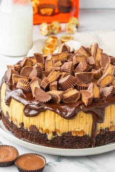 a cake with chocolate and peanut butter on top