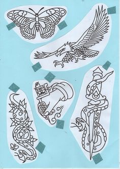 some drawings on paper with scissors and wings