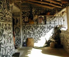 the interior of an old house with decorative wallpaper and decorations on it's walls