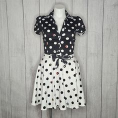 Disney Stitch Shoppe By Loungefly B&W Polka Dot Minnie Mouse Skirt & Top Set, M This Adorable Top And Skirt From Stitch Shoppe By Loungefly Is Crafted In A Fabulous Stretch Sateen And Boasts Disney’s Iconic Mickey And Minnie Mouse In Peek-A-Boo Polka Dots. The Top Has An Oversized Collar Is Embellished With A Scalloped Trim While The Button Up Front Is Secured With A Front Tie And Sweet Short Sleeve Frame Your Figure. The Skirt Is In An Opposite Colorway..And Has Pockets! Disney Stitch Shoppe Mickey Minnie Peek A Boo Dot Skirt Disney Stitch Shoppe Mickey Minnie Peek A Boo Dot Top Both Are Size Medium Measures: (Taken Flat, Double Where Necessary) Top: Pit To Pit - 19" Length - 15.5" Minnie Mouse Skirt, Skirt Top Set, Mickey And Minnie Mouse, Oversized Collar, Dot Skirt, Disney Stitch, Scalloped Trim, Mickey And Minnie, Top And Skirt