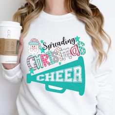 Get your squad ready for the holidays with our festive and fun Christmas Cheerleader Shirts! Perfect for cheerleaders and their squads, these matching Christmas shirts are designed to bring extra cheer to your competition day or holiday gatherings. With a fun graphic that celebrates the spirit of the season, these shirts are sure to make your whole team stand out. ❤  Available in adult, youth, and baby sizes, our shirts make it easy for everyone to join in the fun--whether you're at a holiday event, cheerleading competition, or just celebrating with your squad. The shirts are all white, offering a clean and classic look, while the graphic adds a festive touch perfect for Christmas. Why You'll Love It: 👉 Perfect for Cheer Squads: Matching Christmas shirts to keep your team looking festive Christmas Cheer Shirts, Cheerleader Shirts, Cheerleading Competition, Cheerleading Shirts, Cheer Shirt, Matching Christmas Shirts, Fall Football, Pom Pom Girl, Cheer Squad