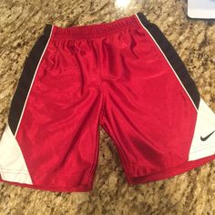 Nike Boys Red Basketball Performance Shorts. Shiny/Sheen Look. No Wear And Tear. Looks Brand New. Sporty Red Shorts For Playwear, Red Cotton Shorts For Playwear, Moisture-wicking Athletic Shorts For Basketball, Casual Team-colored Basketball Shorts, Red Basketball Shorts, Red Cotton Playwear Shorts, Boys Nike Shorts, Team-colored Basketball Shorts, Sporty Moisture-wicking Basketball Shorts