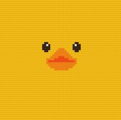 a yellow lego wallpaper with a face made up of two black eyes and an orange beak