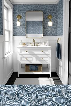 a black and white bathroom with gold accents