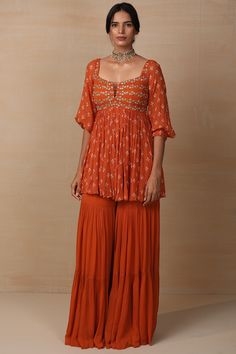 Featuring a rust kurta in georgette base with sequins embroidery. It is paired with matching sharara pants.    FIT: Fitted at bust and waist.  COMPOSITION: Modal satin, Georgette.  CARE: Dry clean only. Embroidered Sharara, Dori Work, Fancy Embroidery, Diwali Outfits, Salwar Kamiz, Indian Dresses Traditional, Traditional Indian Outfits, Ethnic Outfits