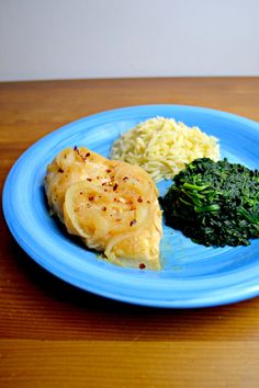 a blue plate topped with different types of food