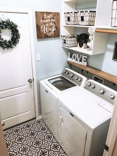 a washer and dryer in a laundry room with the door ajar open