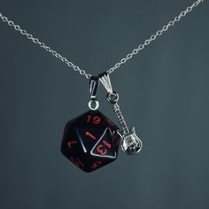 "These handmade rainbow-colored D20 charm necklaces are perfect for any Eddie fan, cosplayer, or enthusiast! Length Charm: 2cm  Material charms: zinc alloy, Resin Material chain: Sterling Silver, Stainless Steel 18K Gold Plated, Stainless Steel, Stainless Steel Gunmetal, Leather Cord and Iron (Color: Gold, Silver, Bronze, Gunmetal) Pictures are taken with \"Short\"(45cm / 17,7 inch) length necklace chains Length Necklace chains:  Choker/ 35cm/ 13,8 inch Short/ 45cm / 17,7 inch  (Leather Cord Lengths) Mid / 55cm / 21,6 inch Long / 65cm / 25,6 inch Custom length options are available! ♦️colors might be different due to light and angle♦️ Prio German shipping/Tracked shipping everywhere else Free Shipping on orders over 35€ worldwide with code \"ISHIPIT35\"!" Black Fandom Jewelry Gift, Black Fandom Inspired Jewelry Gift, Fandom Style Black Jewelry Gift, Music-themed Metal Jewelry For Gifts, Black Music-themed Jewelry For Gift, Fandom Style Personalized Jewelry Gift, Music-themed Black Jewelry Gift, Personalized Fandom Jewelry Gift, Music-themed Charm Jewelry As A Gift