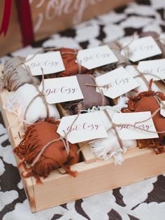 a wooden box filled with lots of brown and white items