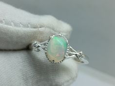 Natural Fire Opal Vintage Diamond Cluster Ring, Opal Stacking Ring, October Ring,925 Sterling Silver, Natural Ethiopian Opal Ring Oval Shape ★ Settings ☆ Metal - 925K Sterling Silver ☆ band Color - White ⍟ The ring size shown in the pictures is 7US. ★ Main Stone ☆ Stone -Opal ☆ Size - 6×8 mm ☆ Shape - Oval ☆ Side Stone - Round CZ Diamonds ★ Features : ☆ Handmade & Made to order. ☆ Ready to ship in 2-3 Business days. ☆ Complimentary gift wrapping. ☆ Free insured worldwide shipping. ★ Links : ☆ Check out my shop - https://rjjewells.etsy.com ★ Notes : ☆ Don't forget to hit the favorite button in order to track the item on your favorites/wish list. ☆ Please leave your phone number at checkout for delivery purposes. Opal Stacking Ring, October Birthstone Ring, October Birthstone Rings, Ethiopian Opal Ring, Ring Opal, Fire Opal Ring, Ring Oval, Diamond Cluster Ring, Opal Ring