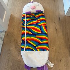 a stuffed llama sleeping bag on the floor