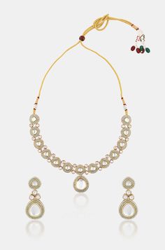 Introducing a mesmerizing long Kundan necklace adorned with opulent meena-inspired details and oversized Kundan stones, accompanied by matching earrings. Crafted from mixed metals with lavish 22kt gold plating, this set radiates timeless elegance and sophistication, perfect for making a grand statement. Finish: 22KT Gold Plating Material: Brass, Kundan & Mint Green Beads Color: White, Green Size: Free Size, Adjustable Closure Type: Draw String Box Contains: 1 Necklace, 1 Pair of Earrings Long Kundan Necklace, Kundan Necklace, Green Beads, Kundan Necklaces, Mixed Metals, Green Bead, White Green, Matching Earrings, Gold Plating