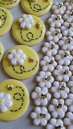 decorated cookies with smiley faces and flowers on them