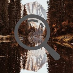 a magnifying glass over a mountain lake